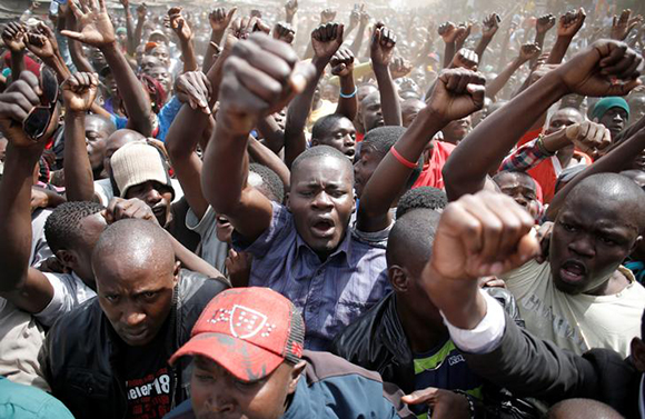 Supporters of opposition leader Raila Odinga shout during a rally in the Kibera slum in Nairobi, Kenya, August 13, 2017. Photo by Goran Tomasevic