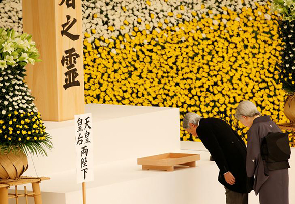 Japan's Emperor Akihito and Empress Michiko bow at an altar for the war dead during a memorial ceremony marking the 72nd anniversary of Japan's surrender in World War Two, at Budokan Hall in Tokyo, Japan August 15, 2017. Photo by Kim Kyung-Hoon