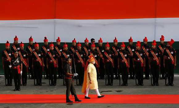 Indian Prime Minister Narendra Modi inspects a guard of honour upon his arrival at the historic Red Fort during Independence Day celebrations in Delhi, India August 15, 2017. Photo by Adnan Abidi