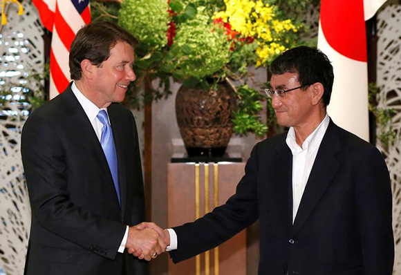 New U.S. Ambassador to Japan William Hagerty (L) is welcomed by Japan's Foreign Minister Taro Kono upon his arrival for a luncheon hosted by Kono at the foreign ministry's Iikura guest house in Tokyo, Japan August 22, 2017. Photo by Issei Kato