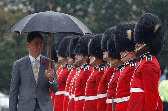 Canada's Prime Minister Justin Trudeau inspects the honour guard, during a ceremony, marking the 75th anniversary of the Dieppe Raid, at the National War Memorial in Ottawa, Ontario, Canada August 22, 2017. Photo by Chris Wattie