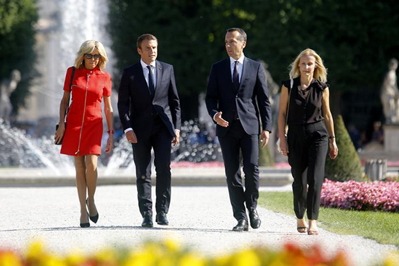 French President Emmanuel Macron and and his wife Brigitte Macron and Austrian Chancellor Christian Kern and his wife Eveline Steinberger-Kern pose for photographers in Salzburg, Austria, August 23, 2017. Photo by Heinz-Peter Bader