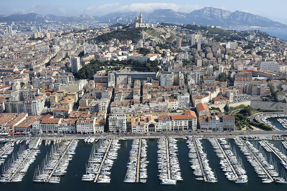 An aerial view shows boats moored in the Old Port of the city of Marseille, France. Photo by Boris Horvat