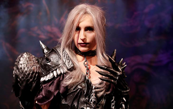 A cosplayer dressed in a self-designed fantasy costume of a 'dungeon woman' poses during the world's largest computer games fair, Gamescom, in Cologne, Germany. Photo by Wolfgang Rattay
