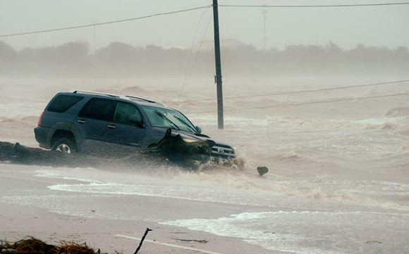 A car is surrounded by floodwaters from Hurricane Harvey in Point Comfort, Texas, August 26, 2017. Photo by Rick Wilking