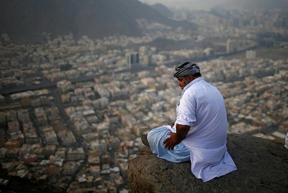A muslim pilgrim visits Mount Al-Noor, where Muslims believe Prophet Mohammad received the first words of the Koran through Gabriel in the Hera cave, in the holy city of Mecca, Saudi Arabia. Photo by Suhaib Salem
