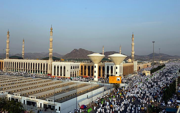Muslim pilgrims gather near Namira Mosque on the plains of Arafat during the annual haj pilgrimage, outside the holy city of Mecca, Saudi Arabia. Photo by Suhaib Salem