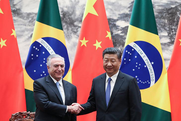 Chinese President Xi Jinping shakes hands with Brazilian President Michel Temer during a signing ceremony at the Great Hall of the People in Beijing, China September 1, 2017. Photo by Lintao Zhang Photo by Lintao Zhang