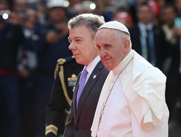 Pope Francis is accompanied by Colombia's President Juan Manuel Santos upon his arrival n Bogota, Colombia, September 6, 2017. Photo by Henry Romero