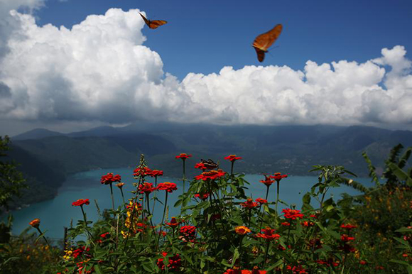 The Coatepeque Lake is seen from a road in the town of El Congo, El Salvador. Photo by Jose Cabezas
