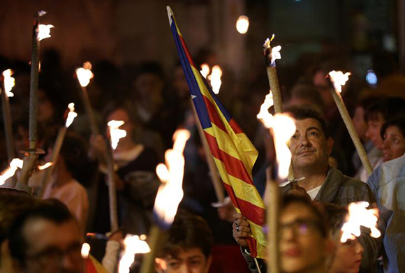 People march with torches during a pro-independence demonstration in Vilafranca del Penedes, Spain. Photo by Albert Gea