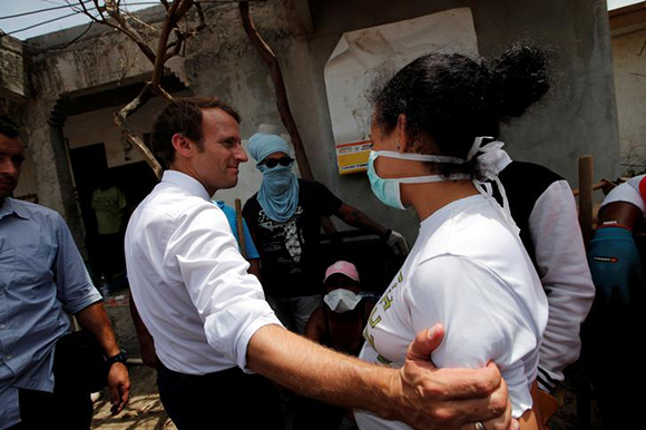 France's President Emmanuel Macron comforts the medical team during his visit to the French Caribbean island of St. Martin September 12, 2017. REUTERS/Christophe Ena/Pool