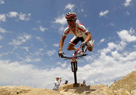 Hungary's Andras Parti reacts as he falls during the men's cross-country mountain bike event at Hadleigh Farm during the London 2012 Olympic Games. Photo by Stefano Rellandini