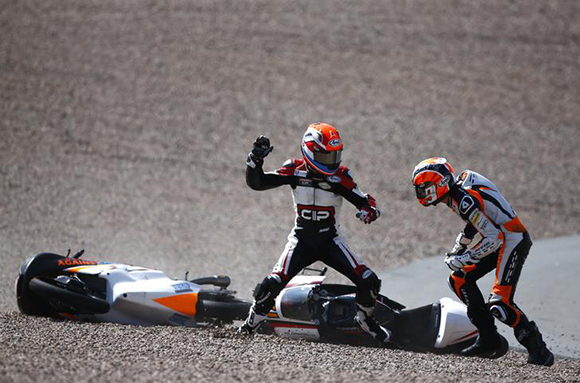 Mahindra Moto3 rider Bryan Schouten of the Netherlands fights with compatriot Kalex KTM Moto3 rider Scott Deroue (R) after they crashed during the German Grand Prix at the Sachsenring circuit in the eastern German town of Hohenstein-Ernstthal Photo by Thomas Peter