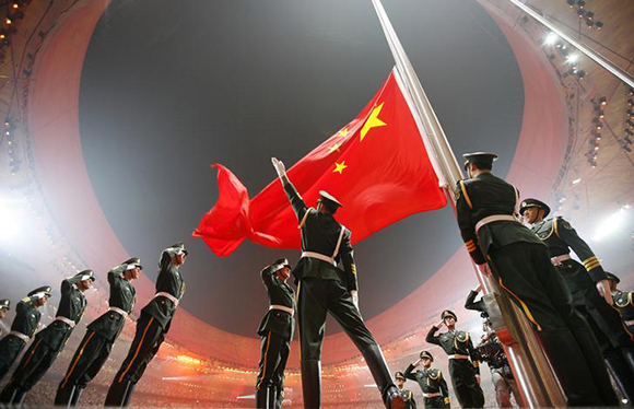China's national flag is raised during the opening ceremony of the Beijing 2008 Olympic Games at the National Stadium Photo by Jerry Lampen