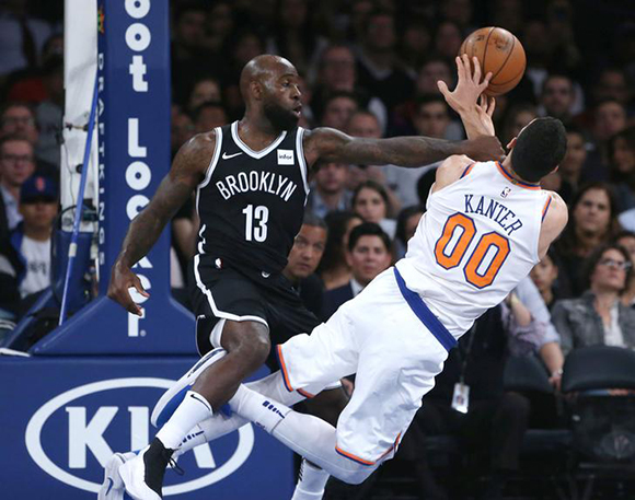 Oct 3, 2017; New York, NY, USA; New York Knicks center Enes Kanter (00) is fouled by Brooklyn Nets forward Quincy Acy (13) during the first half at Madison Square Garden. October 3, 2017. Photo by Noah K. Murray/USA TODAY Sports