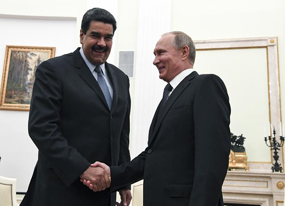 Russian President Vladimir Putin (R) shakes hands with his Venezuelan counterpart Nicolas Maduro during a meeting at the Kremlin in Moscow, Russia October 4, 2017. Photo by Yuri Kadobnov