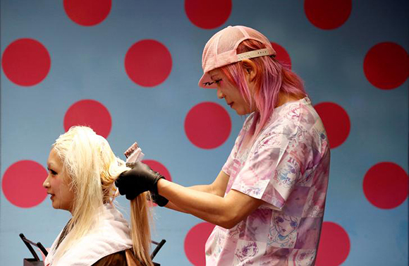 Hair dresser Iku bleaches a woman's hair at "Candye Syrup" hair salon in Tokyo, Japan, October 11, 2017. The hair salon specialises in "kawaii", a Japanese word and concept for "cute" style. Photo by Kim Kyung-Hoon