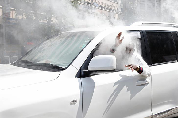  An opposition politician of the National Super Alliance (NASA) coalition, reacts after a gas canister fired by policemen hits his car during a protest along a street in Nairobi, Kenya October 13, 2017. Photo by Baz Ratner 