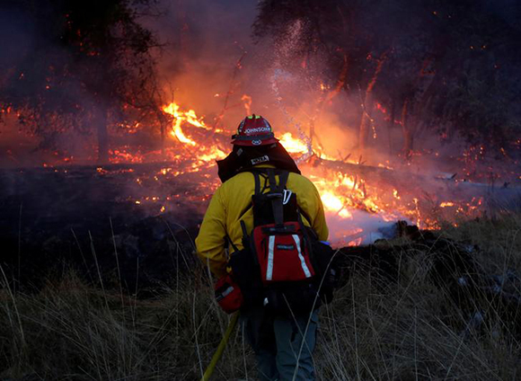  Firefighters battle a wildfire near Santa Rosa, California, U.S. Photo by Jim Urquhart 