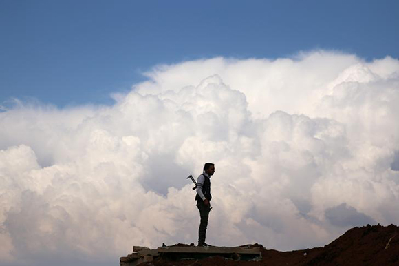  A Free Syrian Army fighter holds his weapon at the rebel-held town of Dael, Syria. Photo by Alaa Al-Faqir 