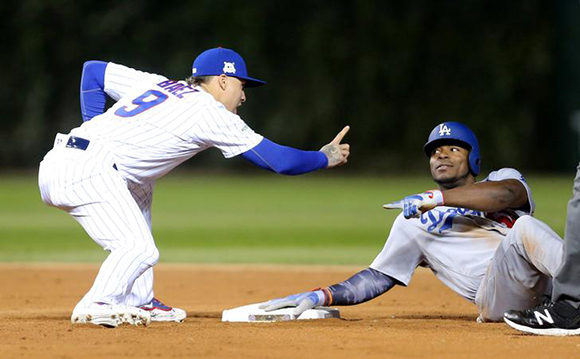  Chicago Cubs second baseman Javier Baez (9) points at Los Angeles Dodgers right fielder Yasiel Puig (66) after Puig was tagged out at second base in the ninth inning during game three of the 2017 NLCS playoff baseball series at Wrigley Field. Chicago, IL, USA, Oct 17, 2017. Photo by Dennis Wierzbicki 