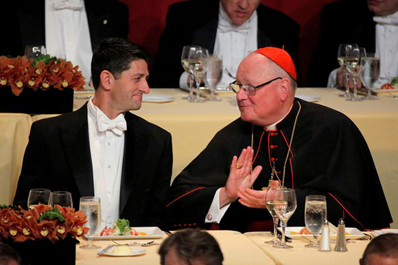  House Speaker Paul Ryan sits with Archbishop of New York Cardinal Timothy Dolan at the 72nd Annual Alfred E. Smith Memorial Foundation Dinner in Manhattan, New York, U.S., October 19, 2017. Photo by Andrew Kelly 