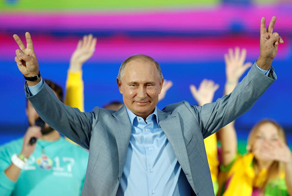  Russian President Vladimir Putin waves to participants of the 19th World Festival of Youth and Students during the closing ceremony at the Olympic Park in Sochi, Russia October 21, 2017. Photo by Erik Alexander Zemlianichenko 