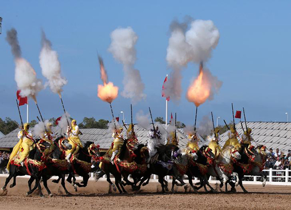  Horse riders perform with guns during the El-Jadida International Horse Show in El-Jadida, south of Casablanca October 21, 2017. Photo by Youssef Boudlal 