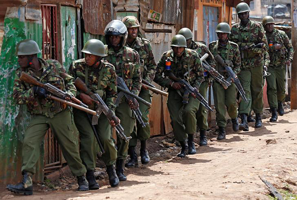  Anti-riot police attempt to disperse protesters in Kawangware slums in Nairobi, Kenya. Photo by Thomas Mukoya 