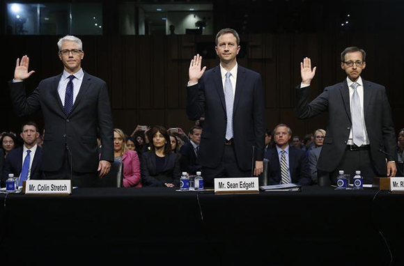 L-R) Colin Stretch, general counsel for Facebook; Sean Edgett, acting general counsel for Twitter; and Richard Salgado, director of law enforcement and information security at Google, are sworn in prior to testifying before Senate Judiciary Crime and Terrorism Subcommittee hearing on on "ways to combat and reduce the amount of Russian propaganda and extremist content online," on Capitol Hill in Washington, U.S., October 31, 2017. Photo by Jonathan Ernst