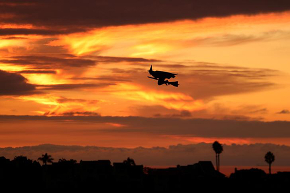  A remote controlled witch on a broom flies over a Southern California neighborhood after sunset on Halloween night in Encinitas, California, U.S. Photo by Mike Blake 