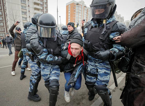  Police officers detain a participant of a Russian nationalist march on National Unity Day in Moscow, Russia November 4, 2017. Photo by Maxim Shemetov 