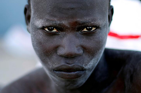  A migrant arrives at a naval base after he was rescued by Libyan coastal guards in Tripoli, Libya. Photo by Ahmed Jadallah 