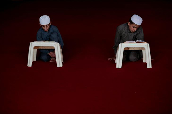  Students memorise the Koran at the Al-Nadwa Madrassa in Murree, Pakistan. Photo by Caren Firouz 