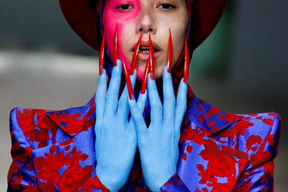  A model presents a creation by Hu Sheguang at China Fashion Week in Beijing, China. Photo by Thomas Peter 