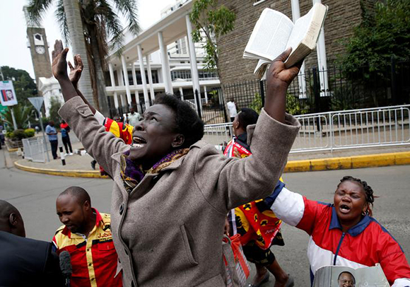  Jubilee Party supporters cheer after Kenya's Supreme Court upheld the re-election of President Uhuru Kenyatta in last month's repeat presidential vote, in Nairobi, Kenya November 20, 2017. Photo by Baz Ratner 