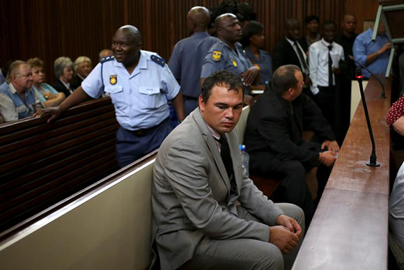  Farmer Willem Oosthuizen sits in the dock before facing sentencing for kidnap, assault and attempted murder, in connection with forcing a man into a coffin, in Middelburg, South Africa, October 27, 2017. Photo by Siphiwe Sibeko 