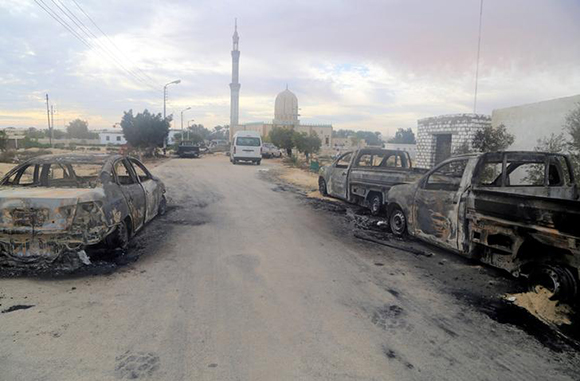  Damaged vehicles are seen after a bomb exploded at Al Rawdah mosque in Bir Al-Abed, Egypt November 25, 2017. Photo by Mohamed Soliman 