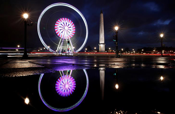  The giant Grande Roue de Paris ferris wheel fills the Paris skyline next to the Luxor Obelisk at the Place de la Concorde during Christmas illuminations in Paris, France. Photo by Christian Hartmann 