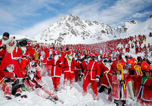  People dressed as Santa Claus enjoy the snow during the Saint Nicholas Day at the Alpine ski resort of Verbier, Switzerland. Photo by Denis Balibouse 