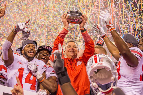  Dec 2, 2017; Indianapolis, IN, USA; Ohio State Buckeyes head coach Urban Meyer holds up the championship trophy with wide receiver K.J. Hill (14) and his players after the game against the Wisconsin Badgers in the Big Ten championship game at Lucas Oil Stadium. Photo by Trevor Ruszkowski 