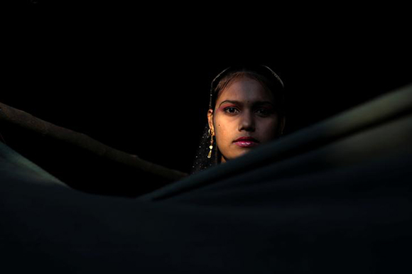  Mamataz Begum 18, a Rohingya refugee stands at the entrance of her temporary shelter at the Kutupalong refugee camp near Cox's Bazar, Bangladesh December 14, 2017. Photo by Marko Djurica 