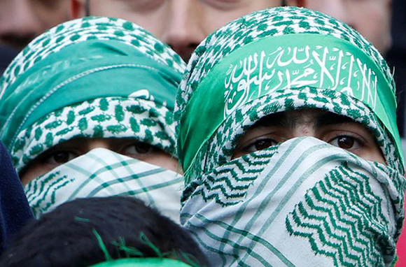  Palestinian Hamas supporters take part in a rally marking the 30th anniversary of Hamas' founding, in the West Bank city of Nablus December 15, 2017. Photo by Abed Omar Qusini 
