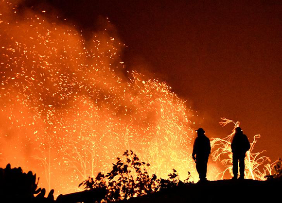  Firefighters keep watch on the Thomas wildfire in the hills and canyons outside Montecito, California, U.S., December 16, 2017. Photo by Gene Blevins 