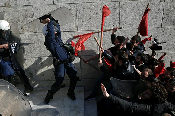  Protesters clash with riot police during a demonstration outside the parliament building against planned government reforms in Athens, Greece January 12, 2018. Photo by Alkis Konstantinidis 