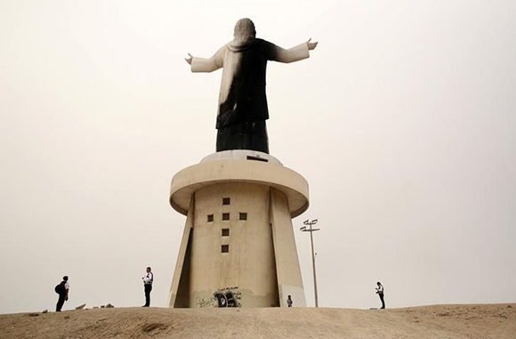  Police investigate near the statue of 'Christ of the Pacific' that was partially burned after a fire at the base of the monument, at Morro Solar hill in Chorrillos, Lima, Peru, January 13, 2018. Photo by Mariana Bazo 