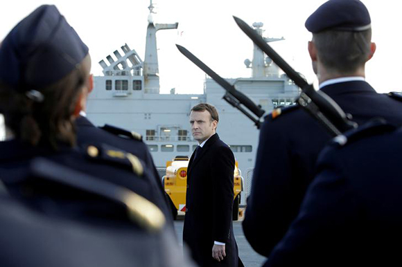  French President Emmanuel Macron reviews an honor guard upon his arrival on board of the French war ship Dixmude docked in the French Navy base of Toulon, southern France, before delivering a speech to present his New Year's wishes to the French Army, January 19, 2018. Photo by Claude Paris 