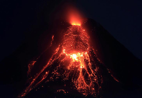  Lava flows from the crater of Mount Mayon Volcano during an eruption in Legazpi city, Albay province, south of Manila, Philippines January 28, 2018. Photo by Romeo Ranoco 