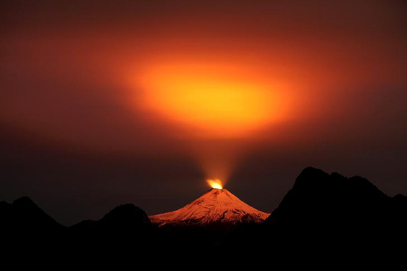  The Villarrica Volcano is seen at night in Pucon town, Chile, May 10, 2015. Villarrica, located near the popular tourist resort of Pucon, is among the most active in South America. Photo by Cristobal Saavedra 